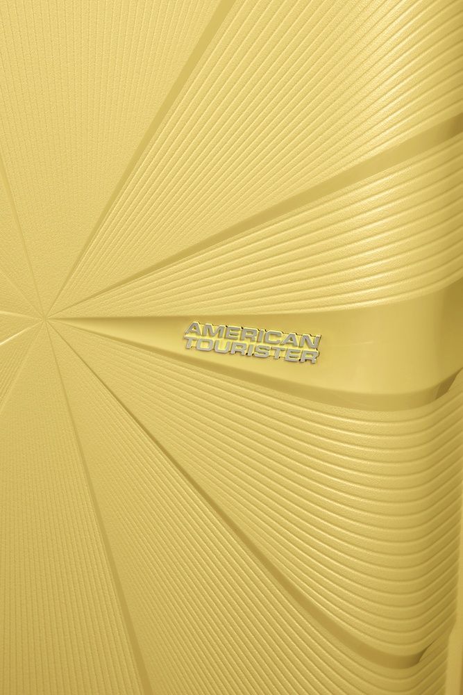 Suitcase American Tourister Starvibe made of polypropylene on 4 wheels MD5*003 Metallic Banana (medium)