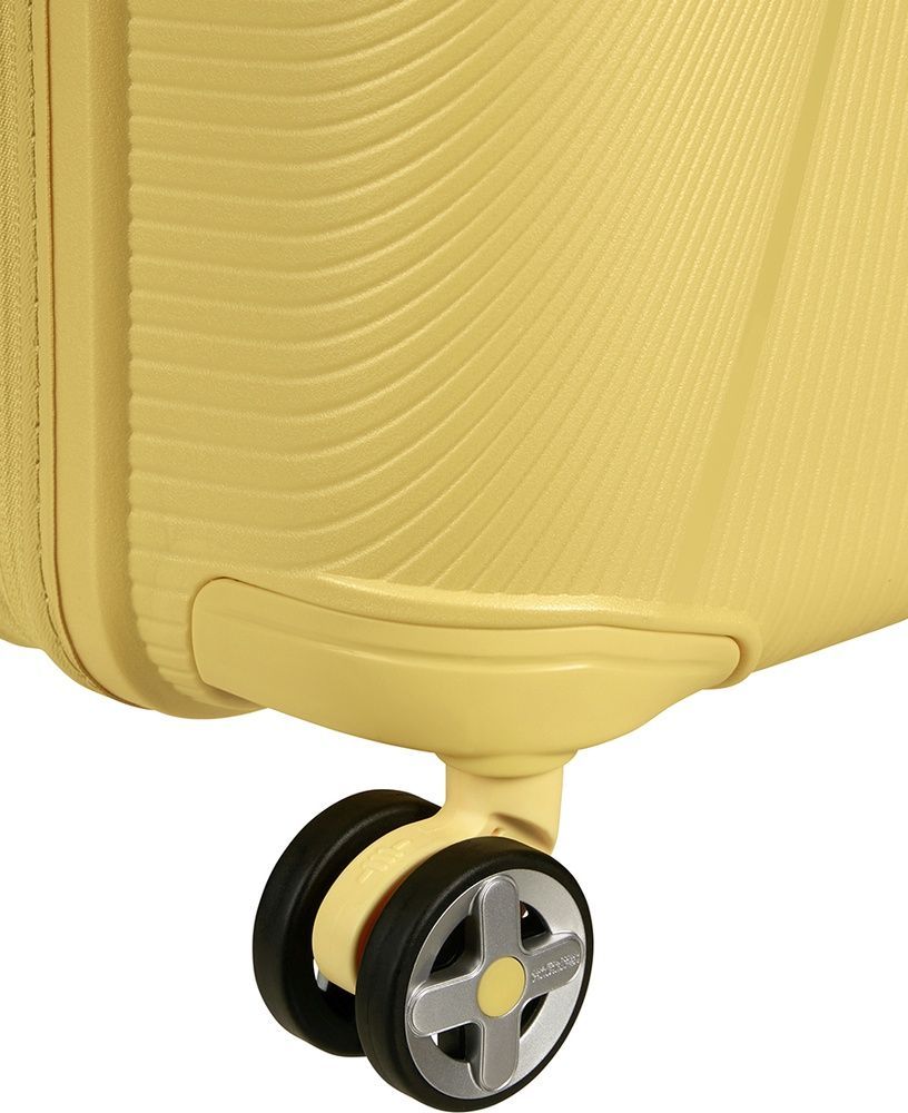 Suitcase American Tourister Starvibe made of polypropylene on 4 wheels MD5*003 Metallic Banana (medium)